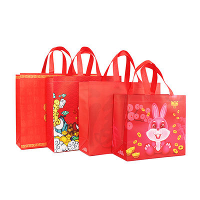 Saco de compras não tecido reusável chinês do punho do saco do presente do ano novo com logotipos